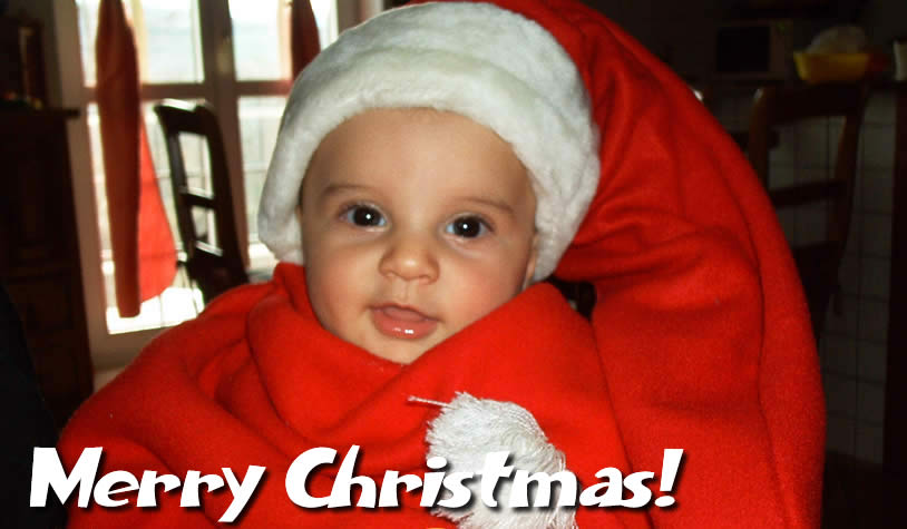 Image with smiling child dressed in Santa Claus costume
